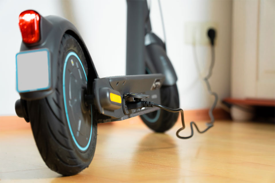 Image of an electric scooter charging inside a house