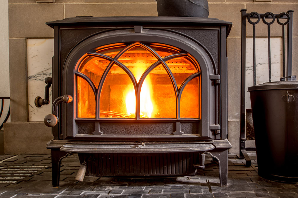 Image of a freestanding wood stove in a house